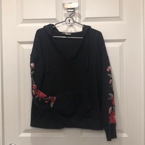 Black pullover with flower detail sleeves